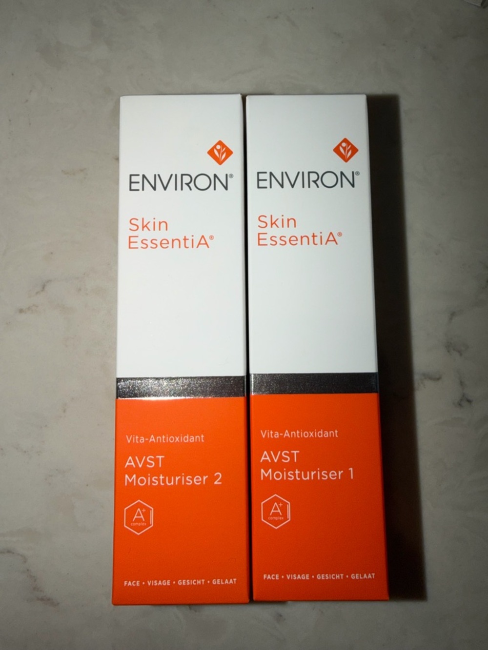 Skin EssentiA AVST Moisturiser 1 & 2 - Orange/White
